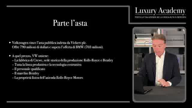Slide: parte l'asta. Volkswagen vince l'asta pubblica indetta da Vickers plc: offre 790 milioni di dollari e supera l'offerta di BMW di 703 milioni. Volkswagen ottiene la fabbrica di Crewe, sede storica della produzione Rolls-Royce e Bentley, tutta la linea produttiva, la tecnologia, il personale, il marchio Bentley e la proprietà fisica di Rolls-Royce Motors.